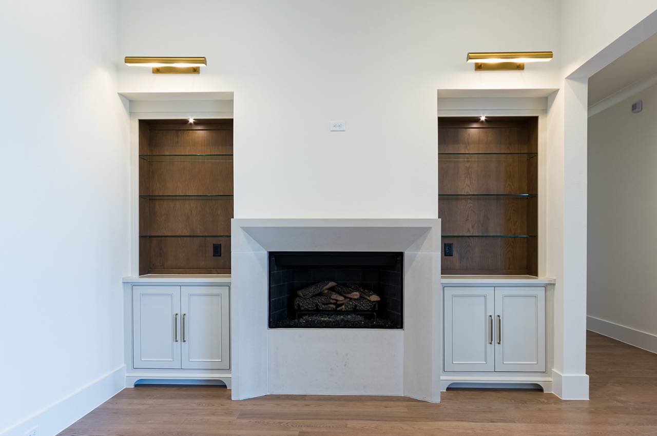 The Keeping Room with storage cabinets and shelves and gas fireplace is a great place to cozy up with a good book!