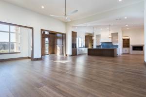 Open floor plan with paneled front entry and keeping room next to kitchen.